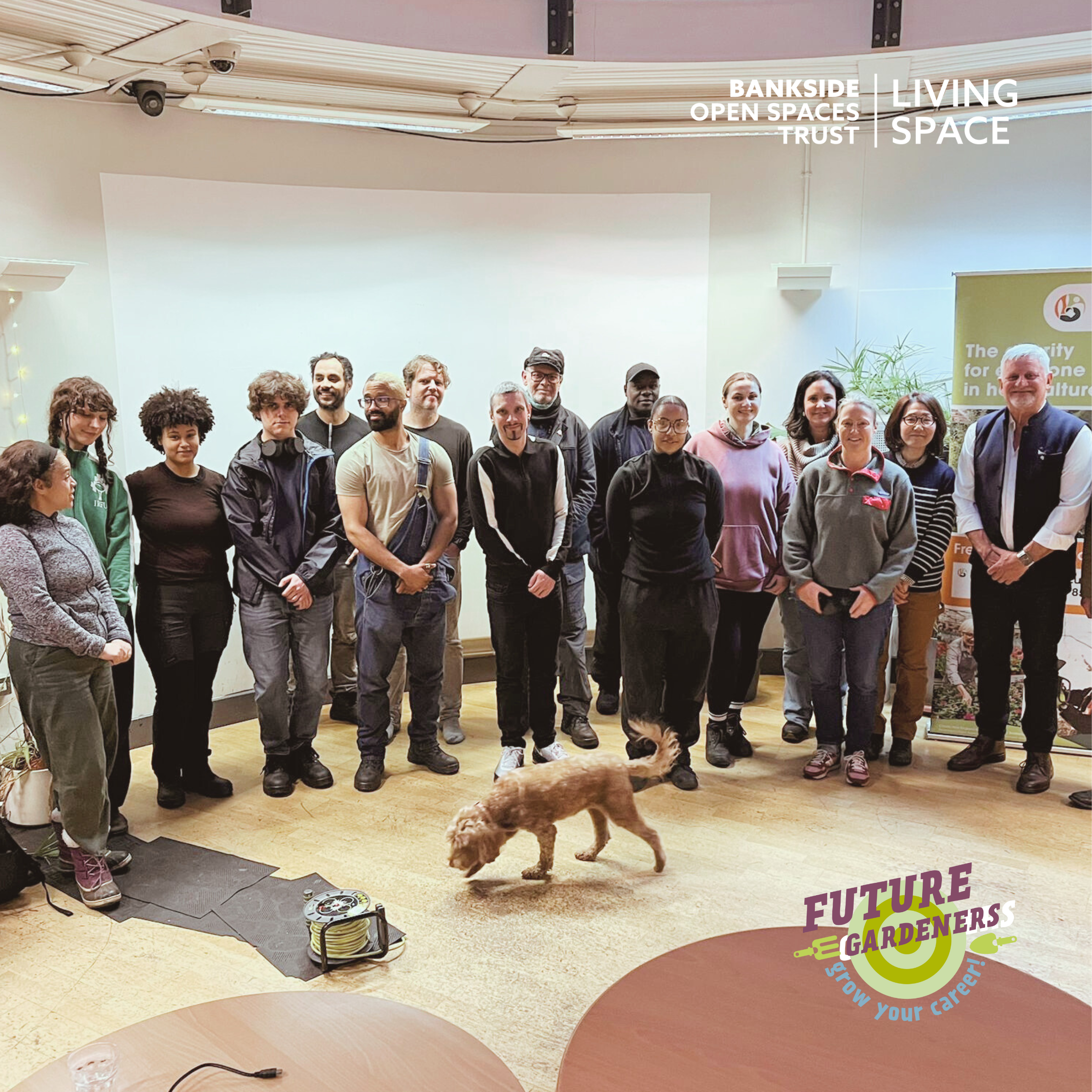 Image of Future Gardeners students with Mark Gregory and programme leaders. A text banner reads 'Future Gardeners welcome Mark Gregory'. A dog is walking across the group shot