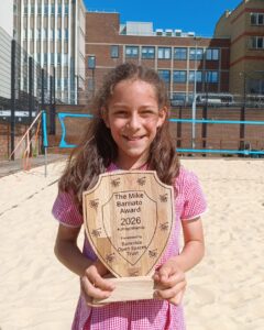 This years Mike Barnato Award Winner , Aisha holding her trophy